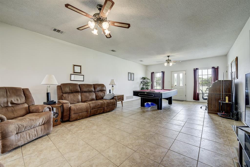 365 Country Lane Haslet, TX 76052 - Photo 4 of 34 a living room with furniture and a fireplace