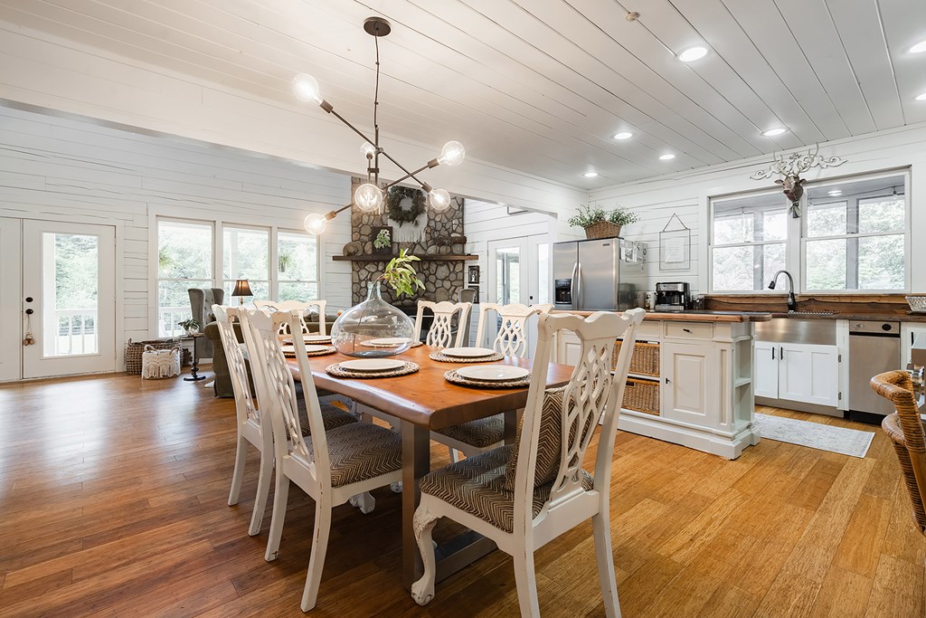 328 Black Ankle Creek Road Cherry Log, GA 30522 - Photo 10 of 103 a view of a dining room and livingroom with furniture wooden floor a chandelier