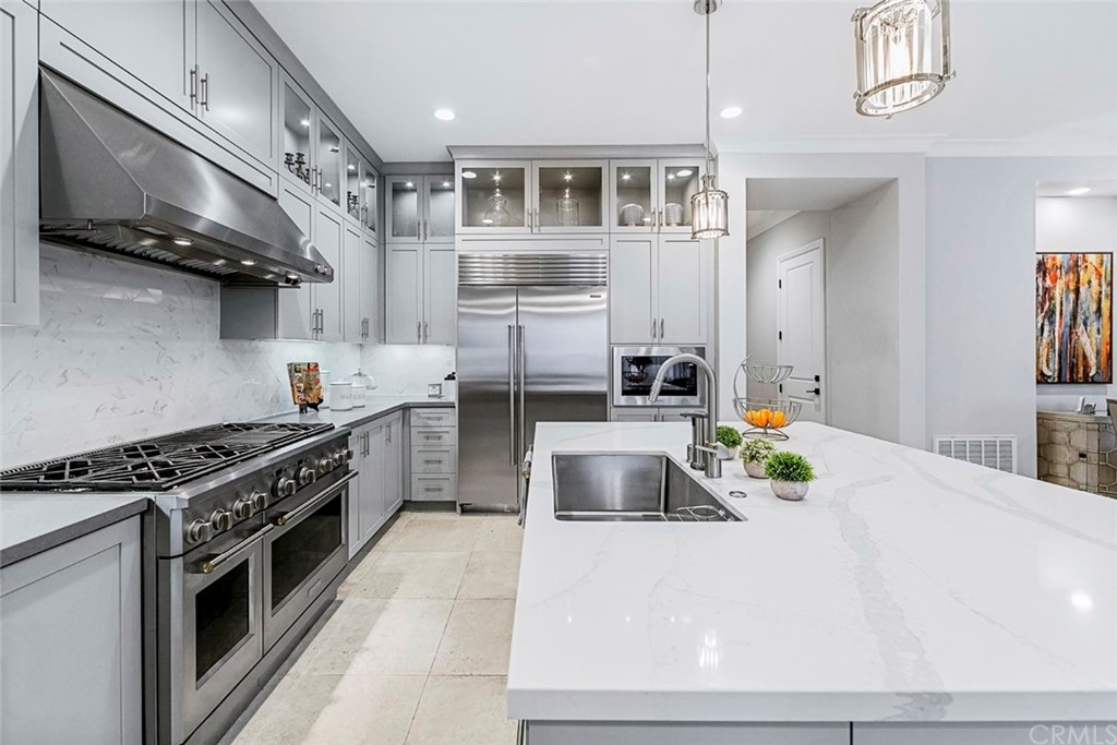 65 Rockinghorse Irvine, CA 92602 - Photo 10 of 43 a kitchen with stainless steel appliances a stove a sink and a refrigerator