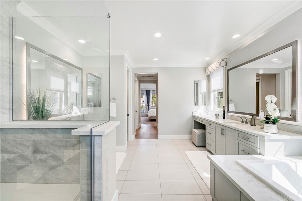 65 Rockinghorse Irvine, CA 92602 - Photo 26 of 43 a large white kitchen with a large window