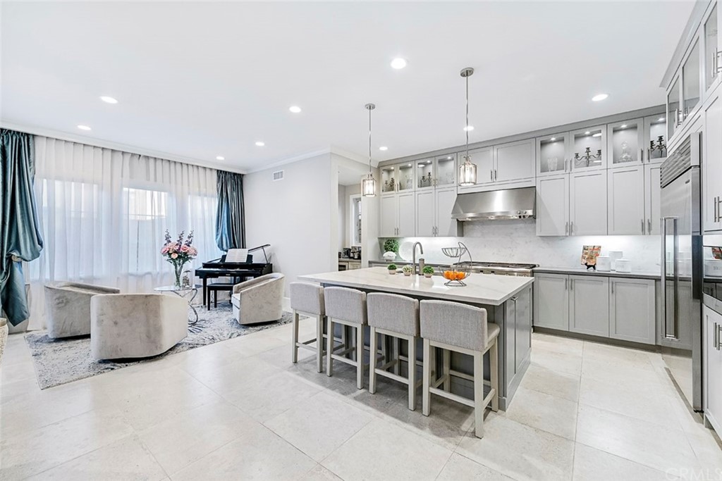 65 Rockinghorse Irvine, CA 92602 - Photo 4 of 43 a kitchen with kitchen island granite countertop lots of counter top space and stainless steel appliances