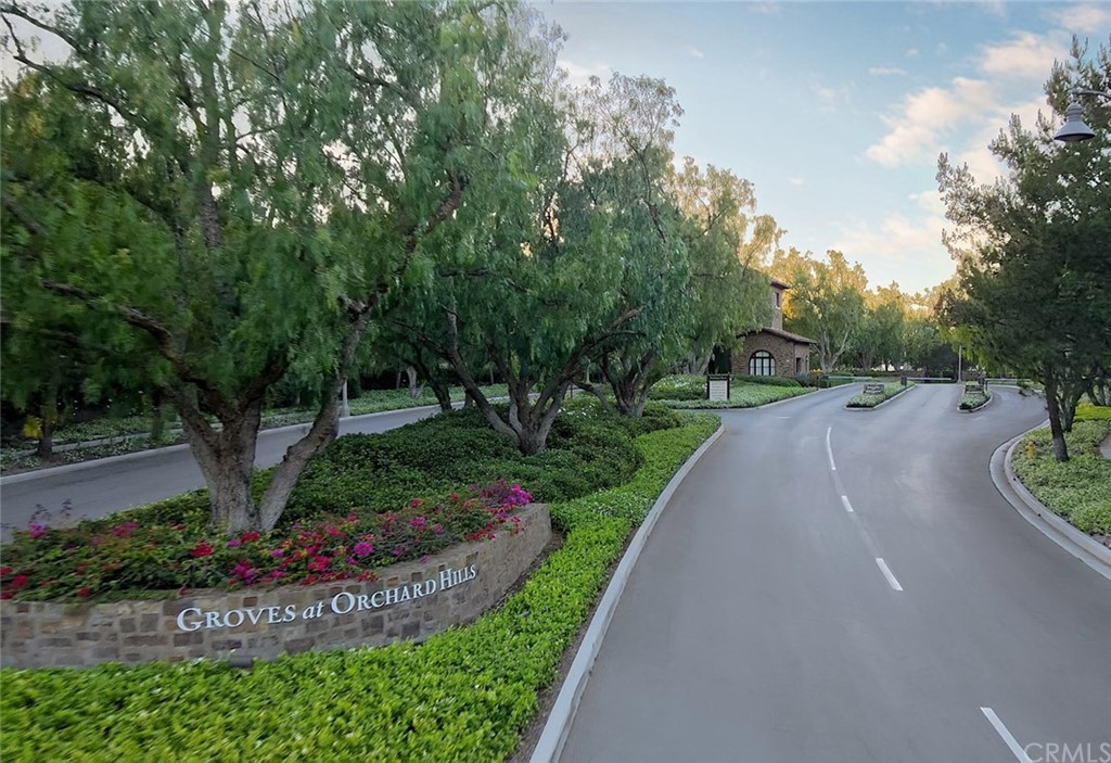 65 Rockinghorse Irvine, CA 92602 - Photo 40 of 43 a view of a street with a bench and trees