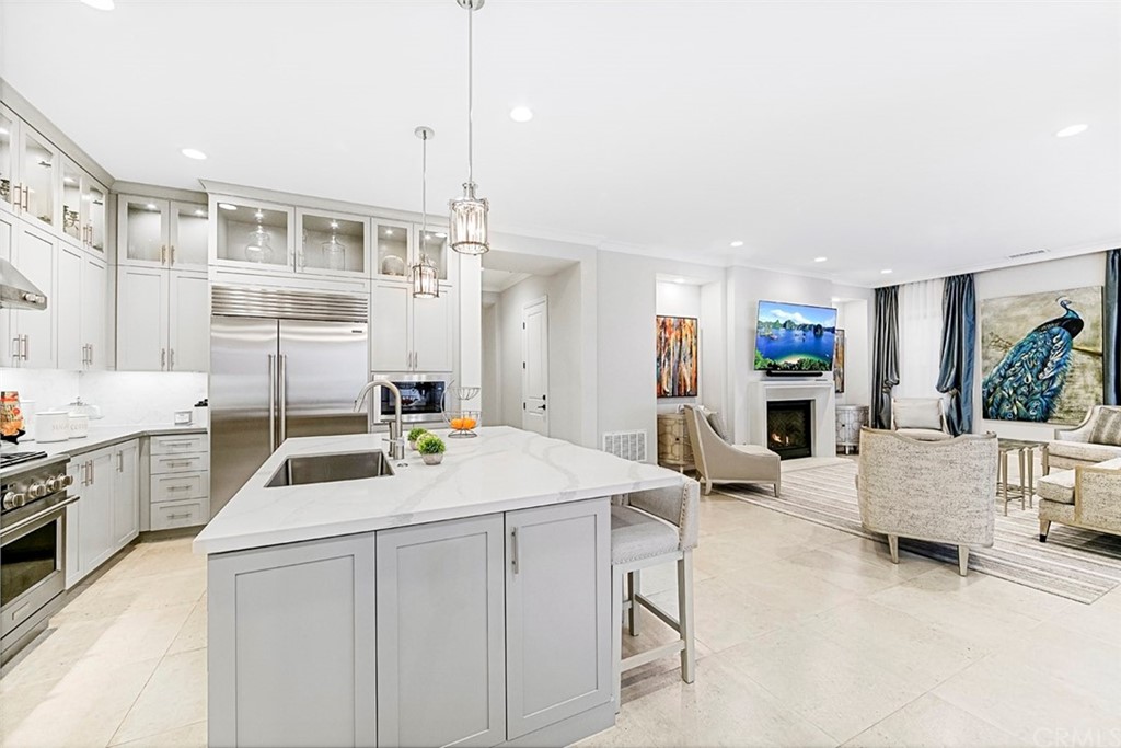 65 Rockinghorse Irvine, CA 92602 - Photo 41 of 43 a kitchen that has a lot of white cabinets and stainless steel appliances