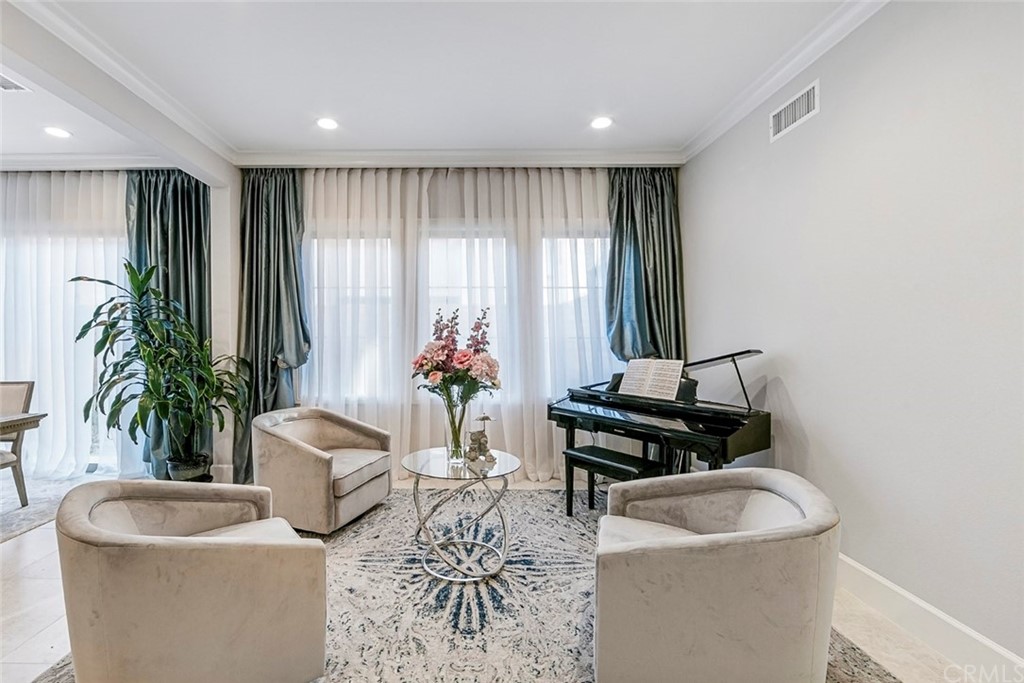 65 Rockinghorse Irvine, CA 92602 - Photo 7 of 43 a living room with furniture and a potted plant