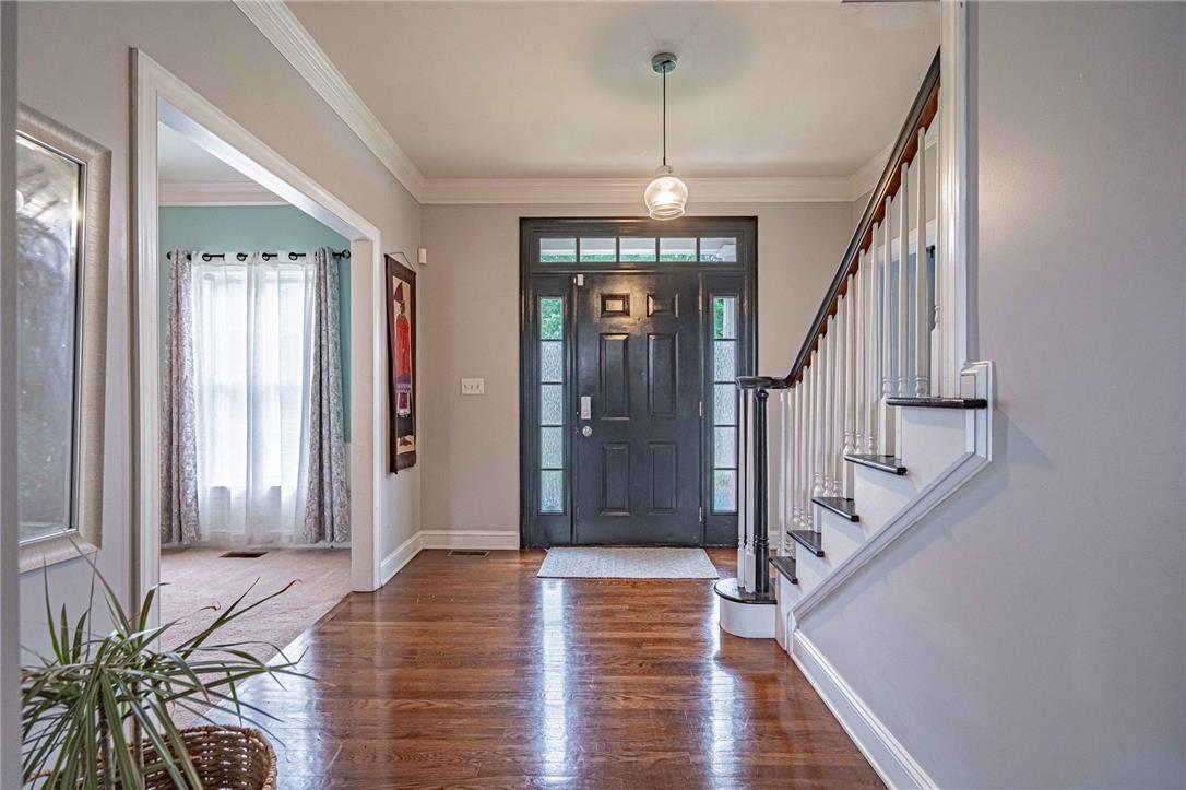 102 Sutton Road Easton, PA 18045 - Photo 34 of 83 Polished hardwood floors and elegant crown molding create an inviting entryway.