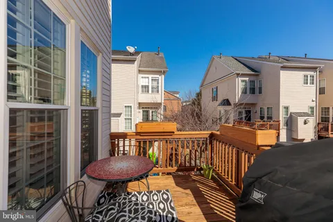 a view of a balcony with furniture and a rug