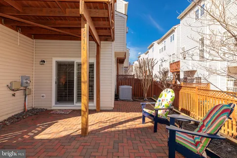 a view of a patio with a table and chairs