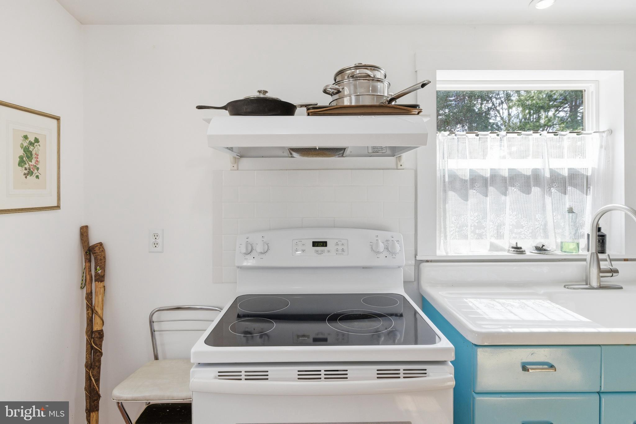 769 Rocky Branch Road Luray, VA 22835 - Photo 13 of 94 a white stove top oven sitting inside of a kitchen