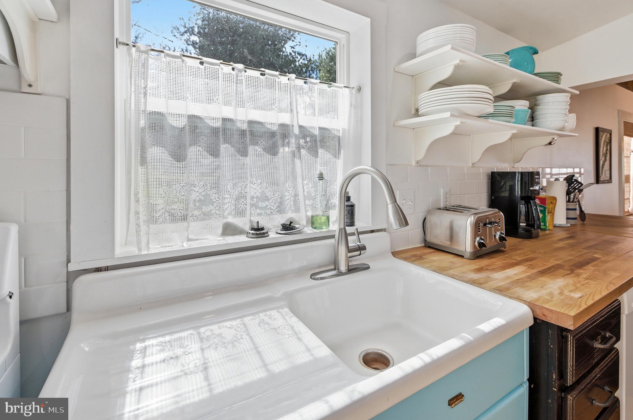 769 Rocky Branch Road Luray, VA 22835 - Photo 15 of 94 a kitchen with a sink a counter top space and living room view