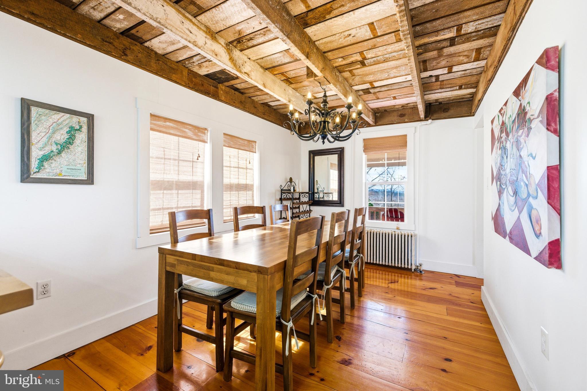 769 Rocky Branch Road Luray, VA 22835 - Photo 18 of 94 a view of a dining room with furniture and a chandelier