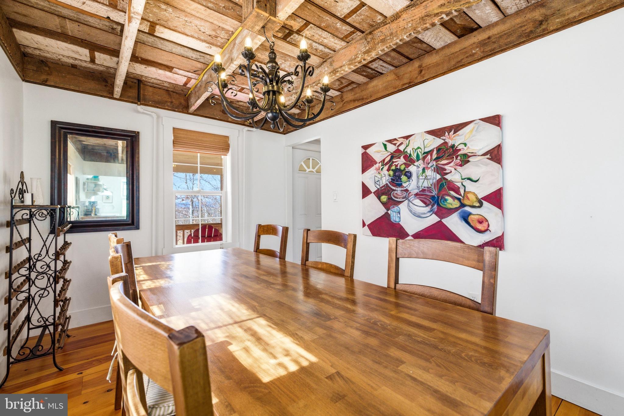 769 Rocky Branch Road Luray, VA 22835 - Photo 19 of 94 a dining room with furniture a rug and wooden floor