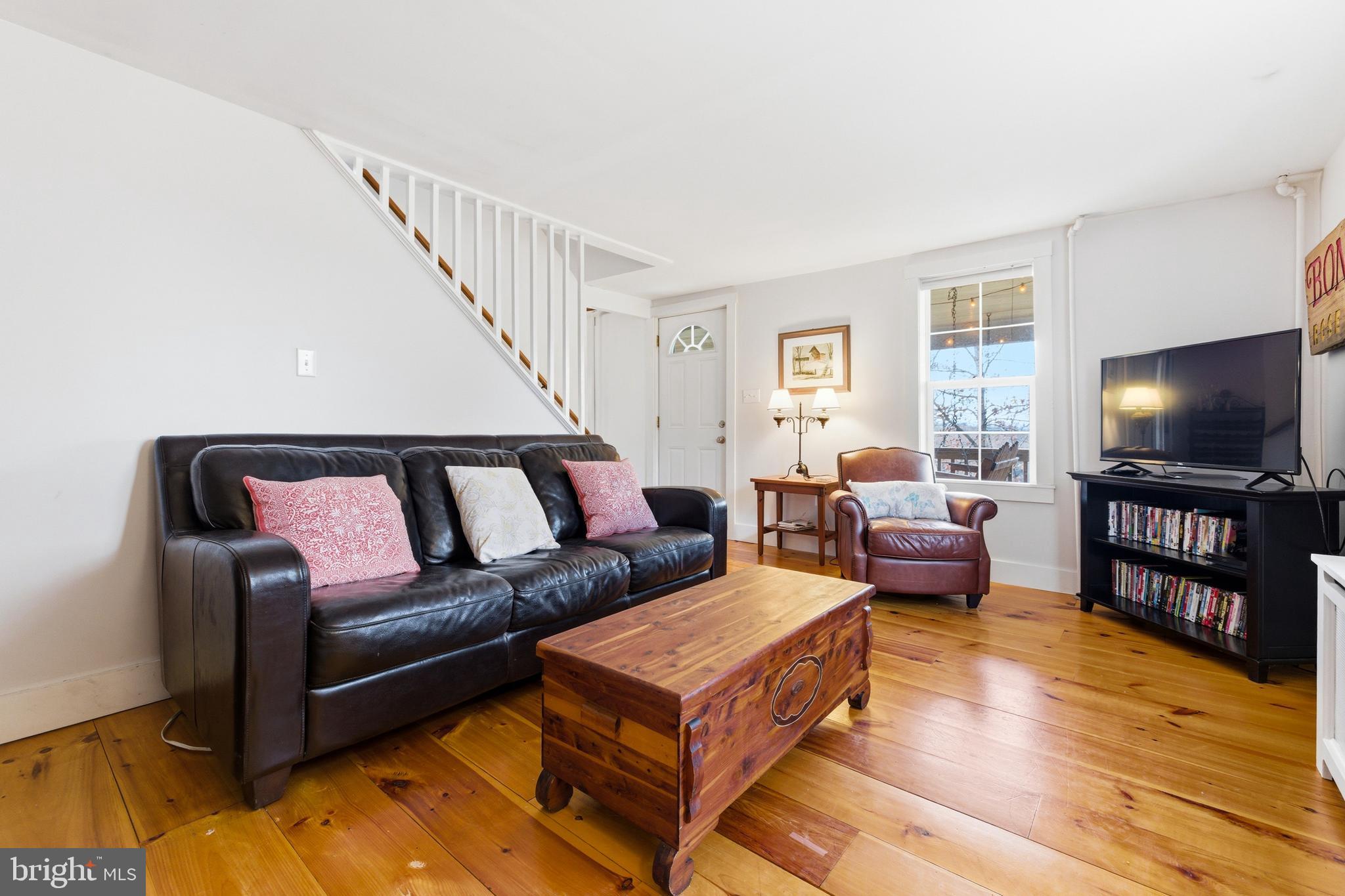 769 Rocky Branch Road Luray, VA 22835 - Photo 23 of 94 a living room with furniture and a flat screen tv