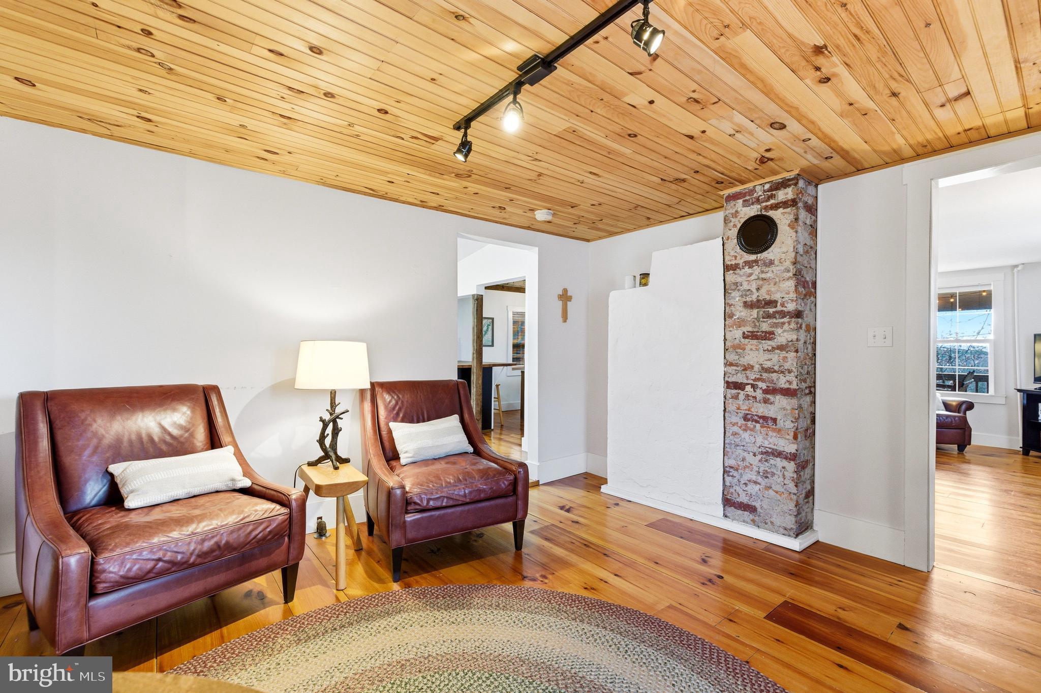 769 Rocky Branch Road Luray, VA 22835 - Photo 30 of 94 a living room with furniture and a wooden floor