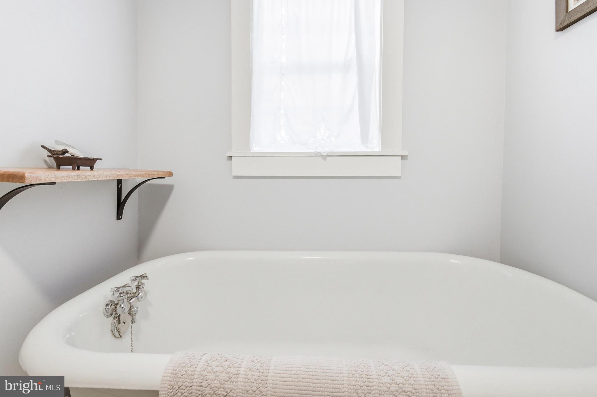 769 Rocky Branch Road Luray, VA 22835 - Photo 34 of 94 a white bath tub sitting in a bathroom