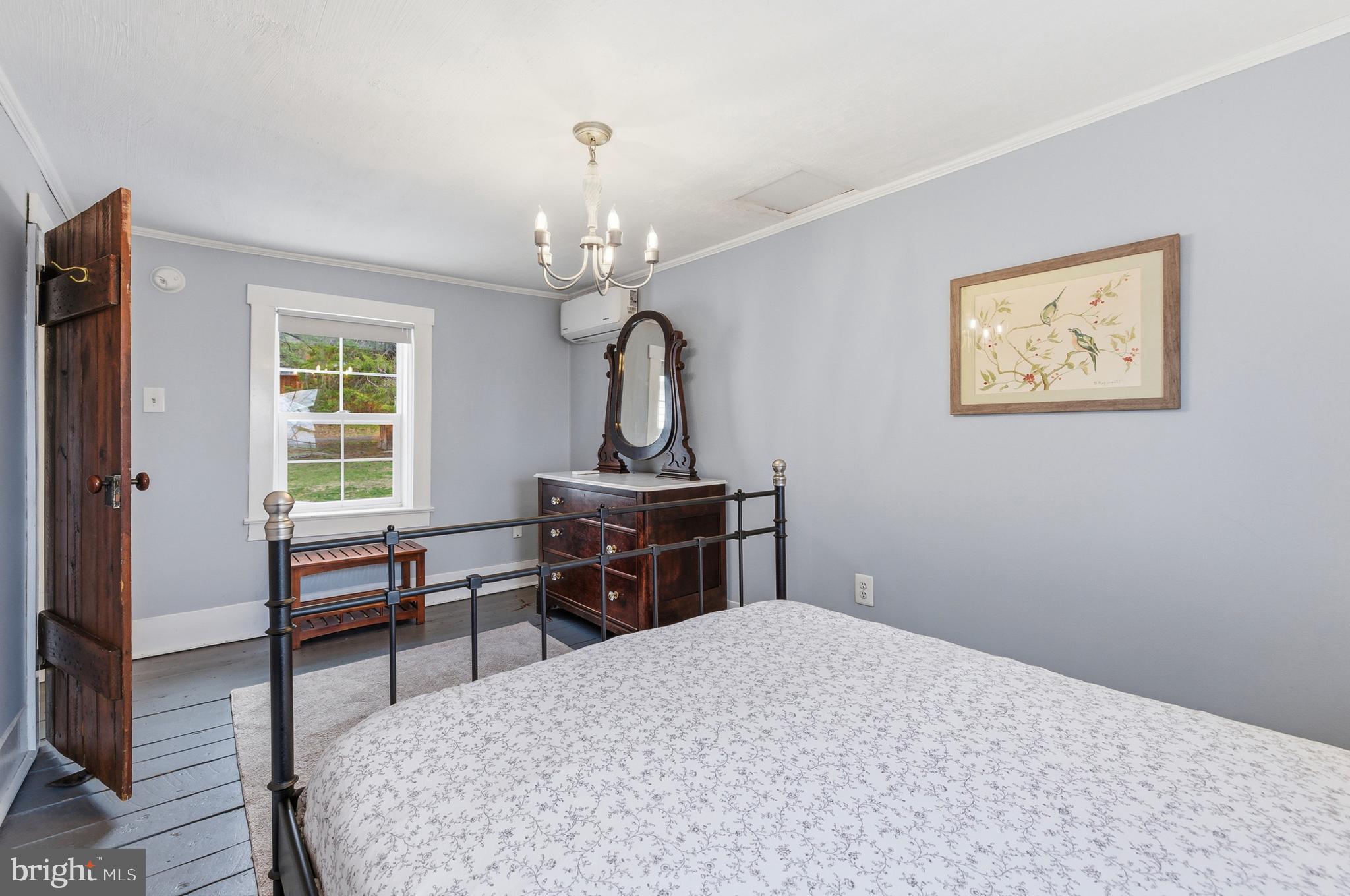 769 Rocky Branch Road Luray, VA 22835 - Photo 44 of 94 a bedroom with a bed and a dresser next to a window
