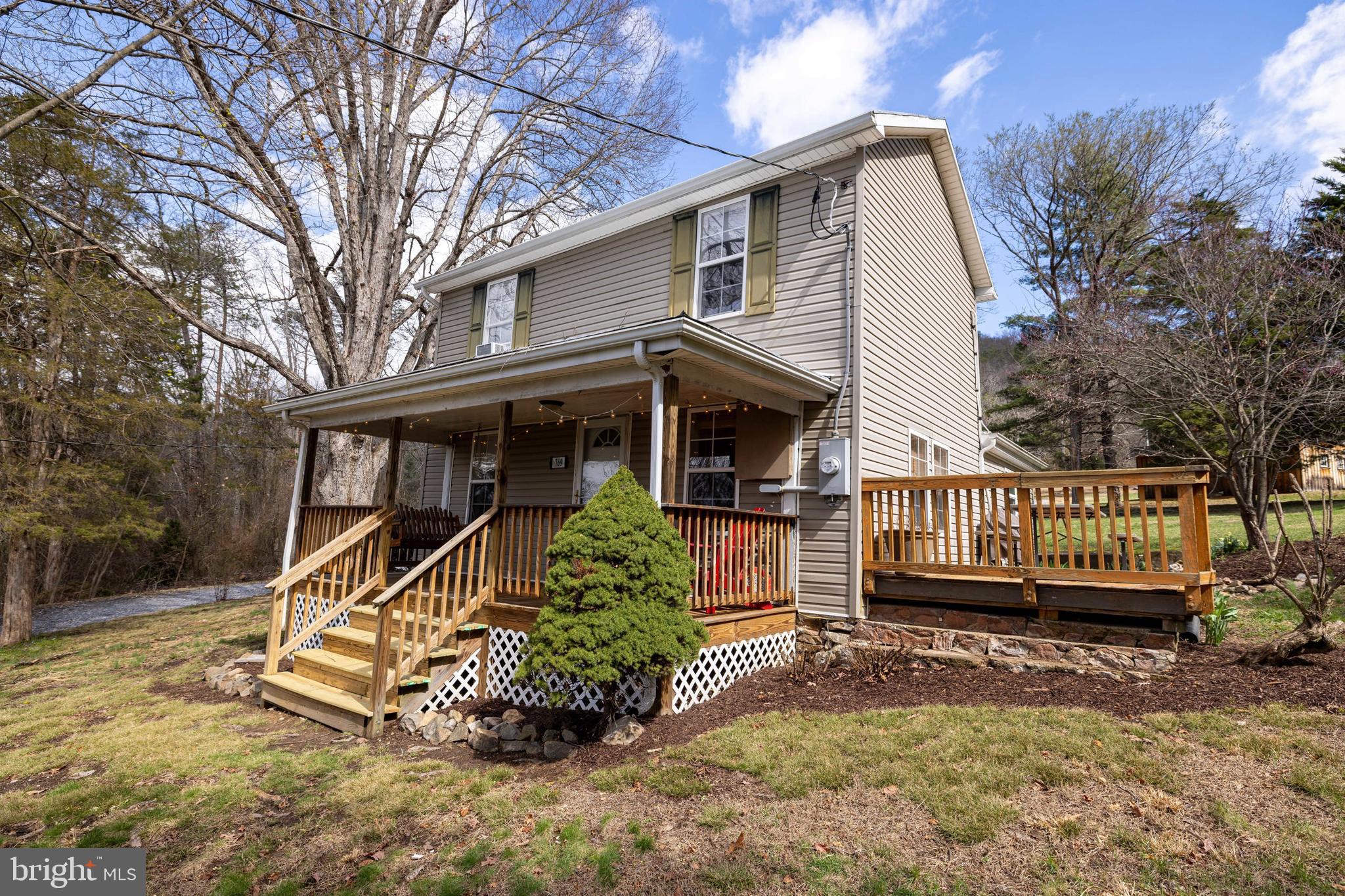 769 Rocky Branch Road Luray, VA 22835 - Photo 50 of 94 a view of a house with a yard and wooden deck