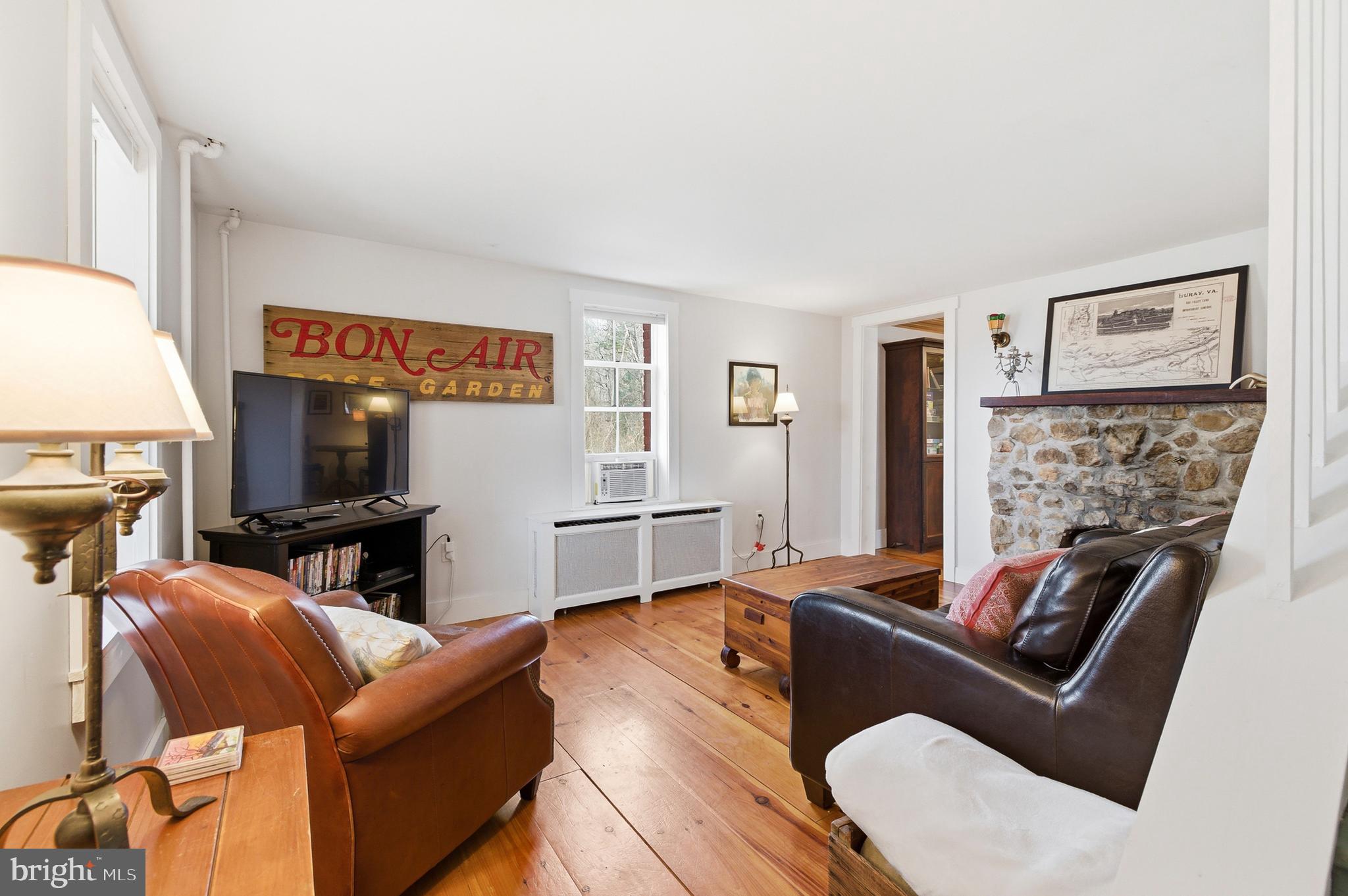 769 Rocky Branch Road Luray, VA 22835 - Photo 5 of 94 a living room with furniture and a flat screen tv
