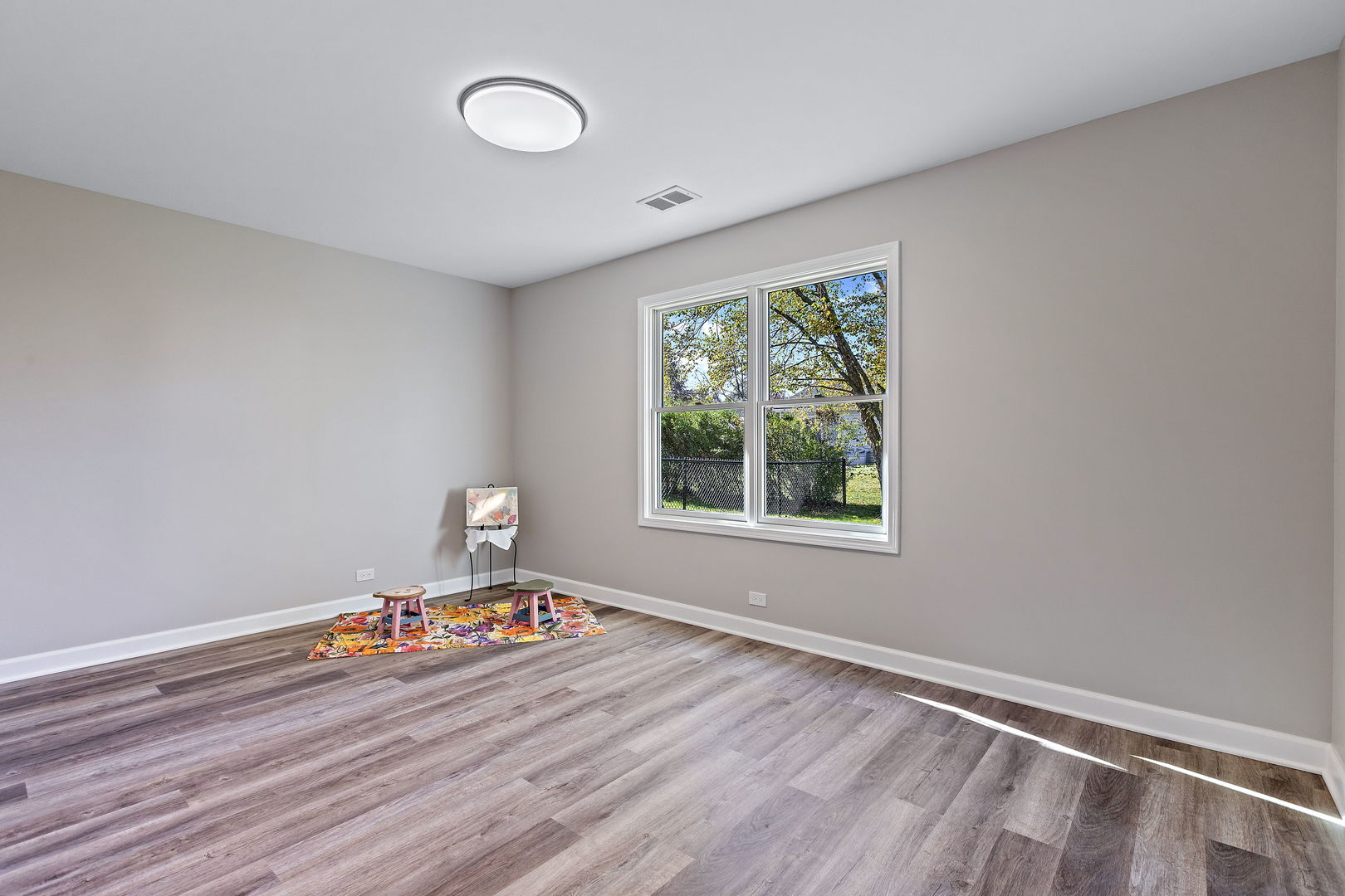 1044 Greenridge Road Buffalo Grove, IL 60089 - Photo 13 of 19 a room with a wooden floor and a window