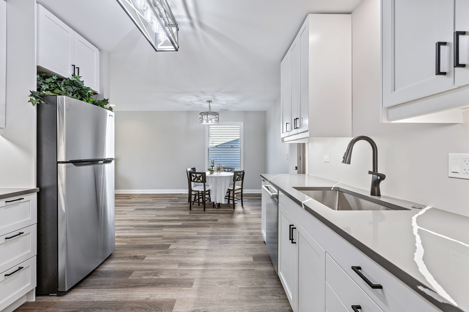1044 Greenridge Road Buffalo Grove, IL 60089 - Photo 4 of 19 a kitchen with refrigerator and cabinets