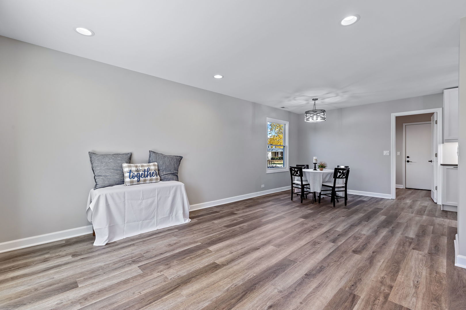 1044 Greenridge Road Buffalo Grove, IL 60089 - Photo 7 of 19 a spacious bedroom with a bed and a table in it