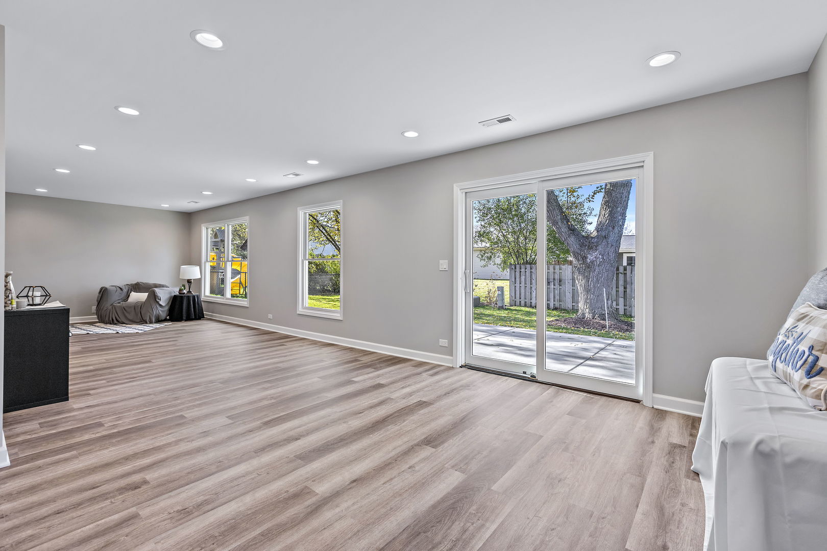 1044 Greenridge Road Buffalo Grove, IL 60089 - Photo 9 of 19 a view of an empty room with wooden floor and a window