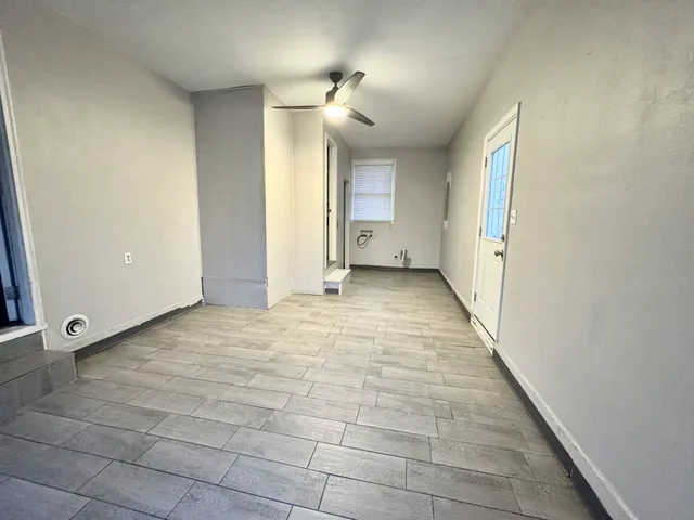 a white toilet sitting next to a bathroom sink