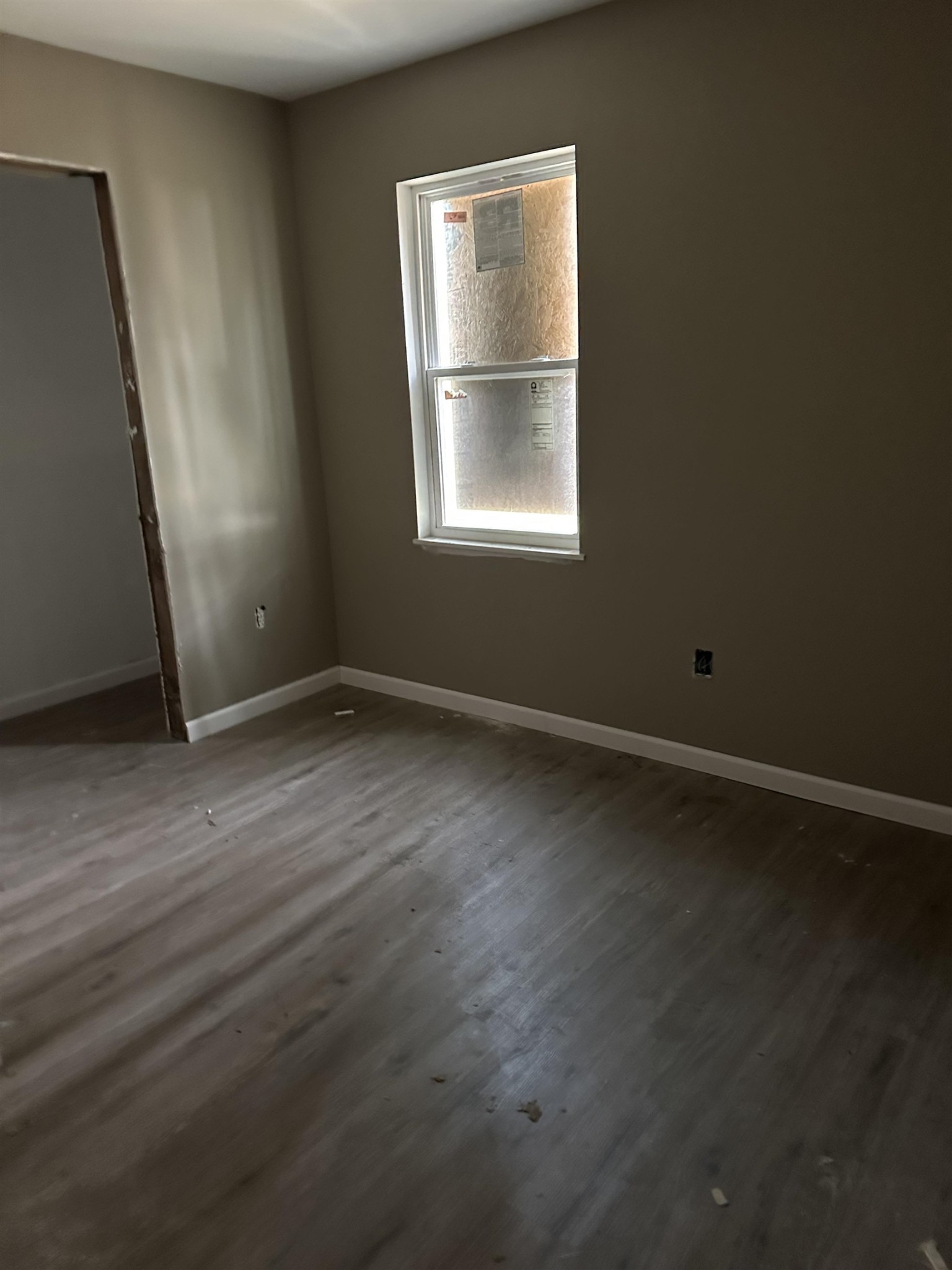3076 St Croix Place, Unit 92 Memphis, TN 38127 - Photo 12 of 13 an empty room with wooden floor and windows