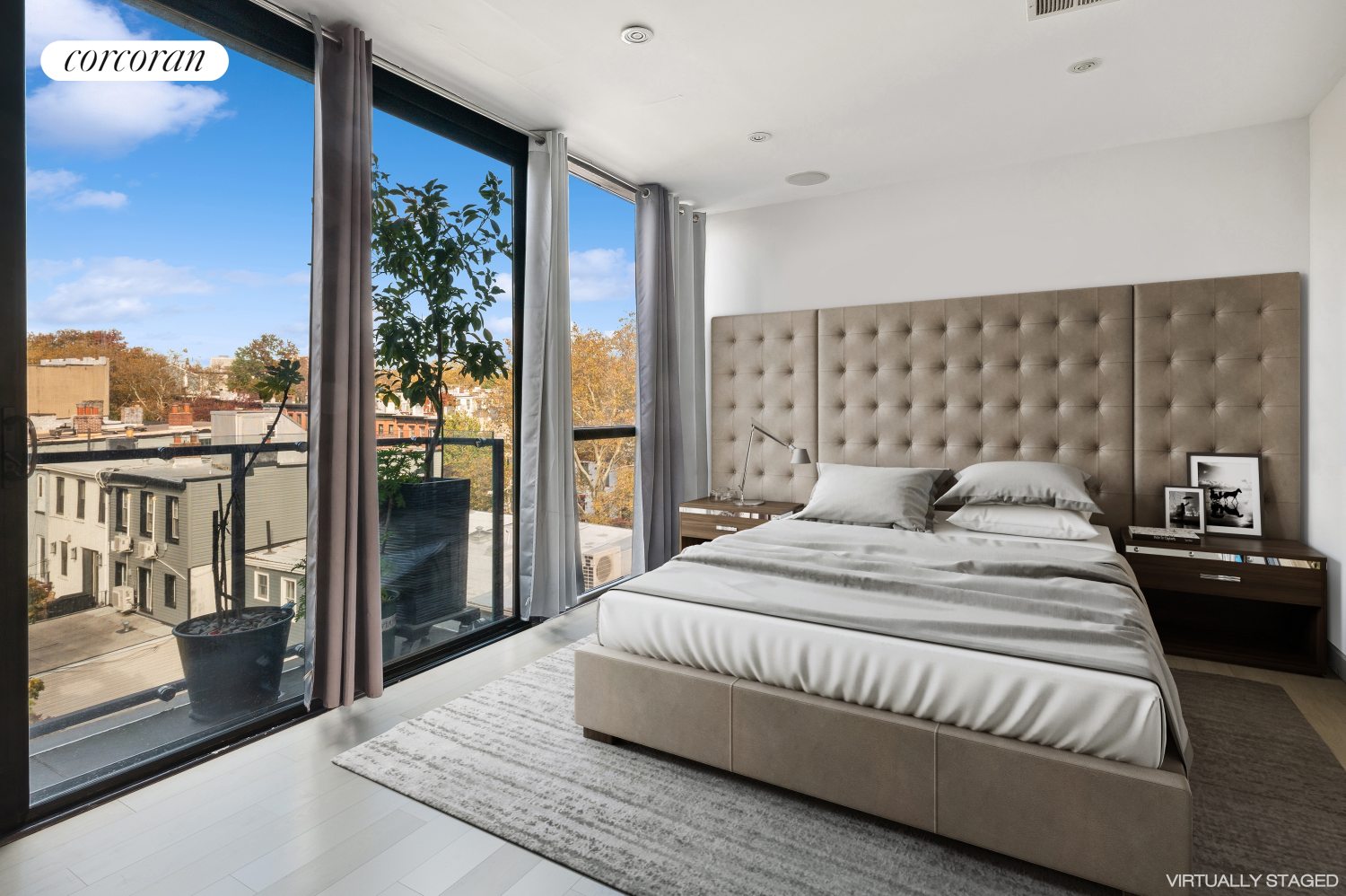 a spacious bedroom with a bed and glass door