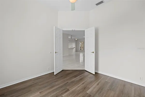 a bath room with a sink a toilet and a mirror