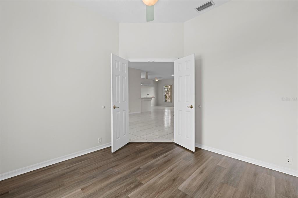 9369 Ashley Drive Weeki Wachee, FL 34613 - Photo 25 of 80 wooden floor in an empty room