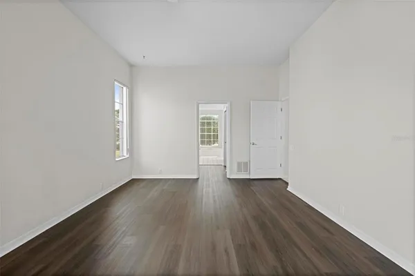a white toilet sitting next to a window