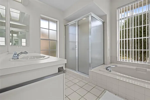 a view of backyard of house with green space