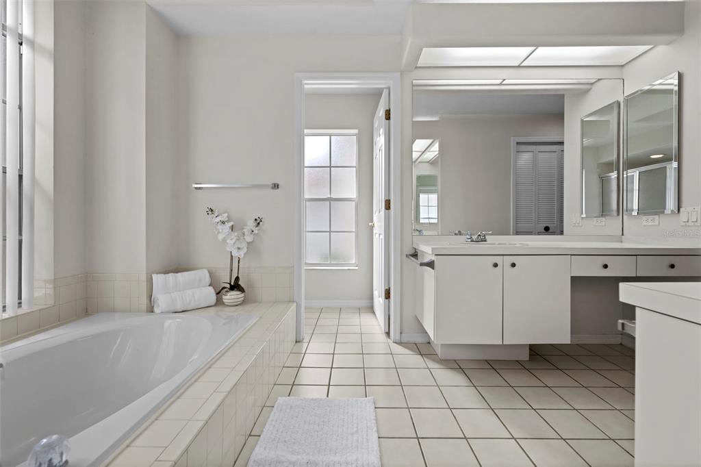 9369 Ashley Drive Weeki Wachee, FL 34613 - Photo 34 of 80 a bathroom with a sink a toilet and mirror