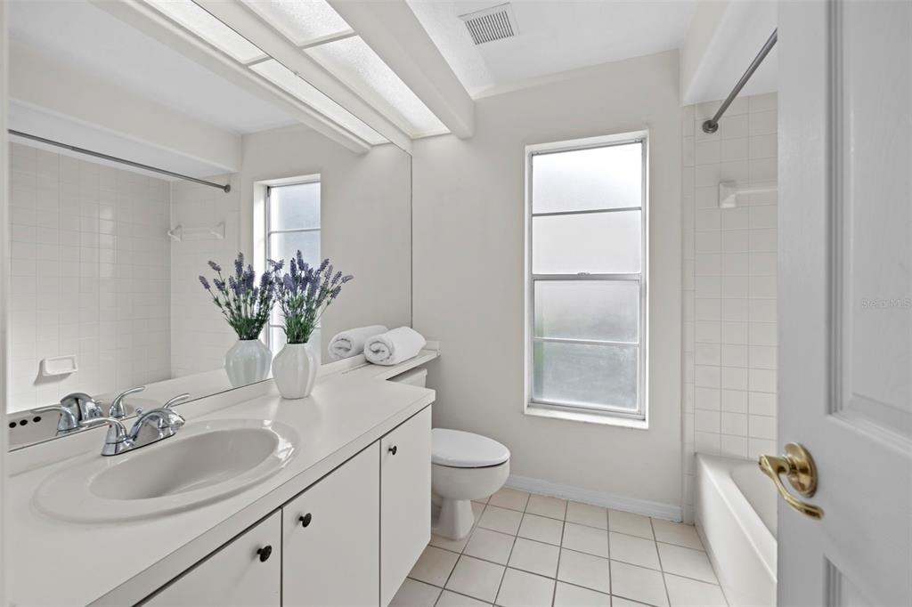 9369 Ashley Drive Weeki Wachee, FL 34613 - Photo 43 of 80 a bathroom with a sink toilet and shower