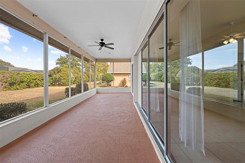 9369 Ashley Drive Weeki Wachee, FL 34613 - Photo 48 of 80 a view of hallway with a large window and an outdoor view