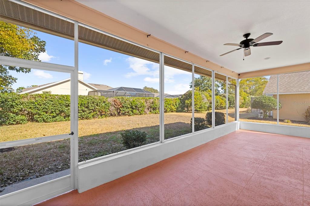 9369 Ashley Drive Weeki Wachee, FL 34613 - Photo 49 of 80 a view of a living room and a floor to ceiling window