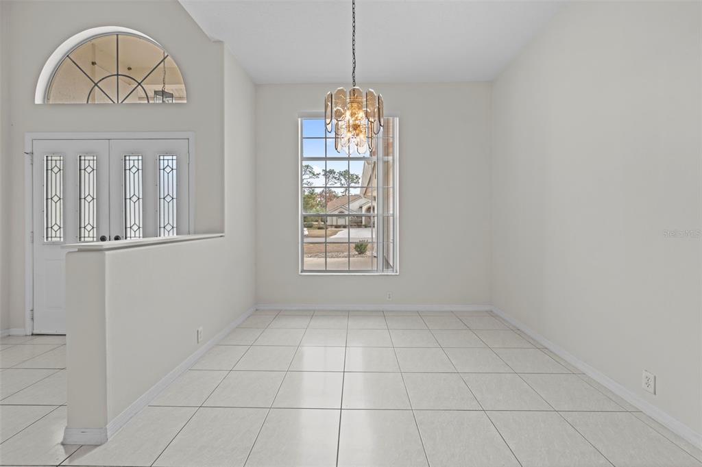 9369 Ashley Drive Weeki Wachee, FL 34613 - Photo 6 of 80 a view of livingroom with window