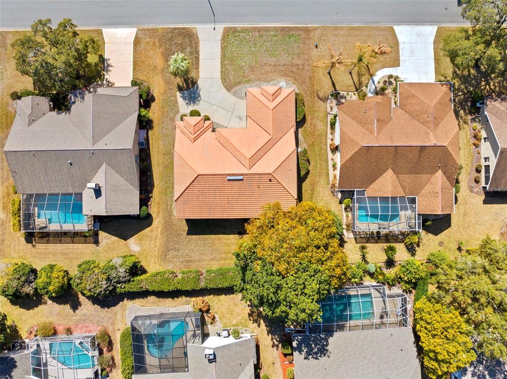 9369 Ashley Drive Weeki Wachee, FL 34613 - Photo 64 of 80 an aerial view of residential houses with outdoor space