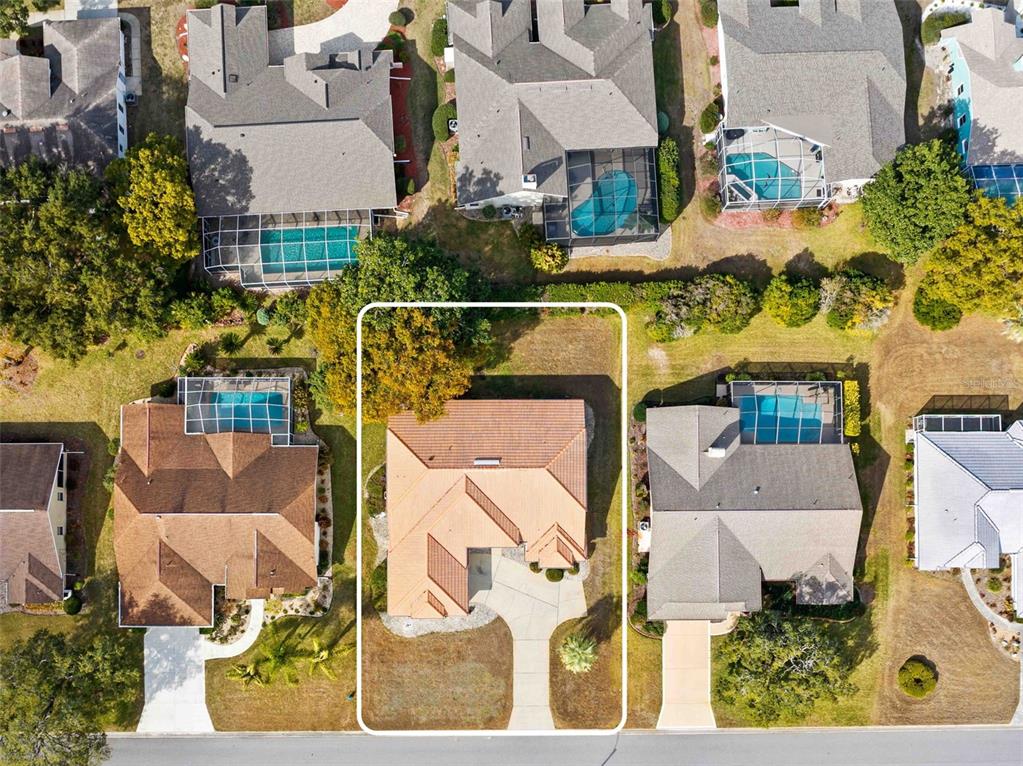 9369 Ashley Drive Weeki Wachee, FL 34613 - Photo 65 of 80 an aerial view of residential houses with outdoor space