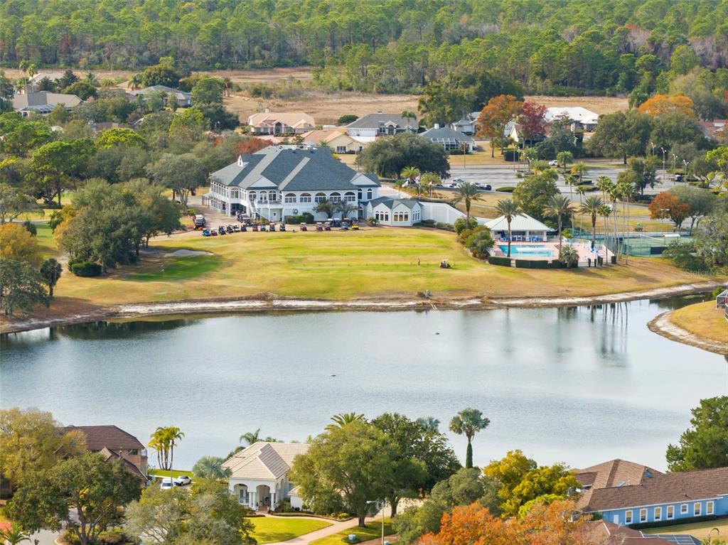 9369 Ashley Drive Weeki Wachee, FL 34613 - Photo 68 of 80 an aerial view of residential houses with outdoor space and lake view