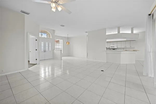 a kitchen with white cabinets and a sink