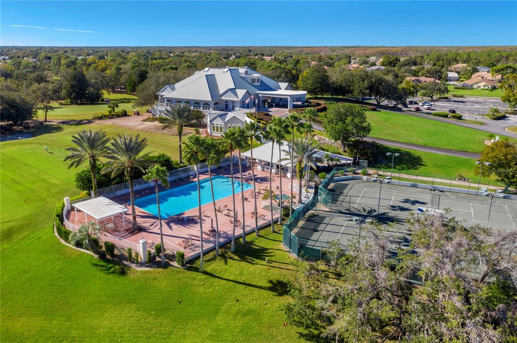 9369 Ashley Drive Weeki Wachee, FL 34613 - Photo 74 of 80 an aerial view of a house with a garden and lake view
