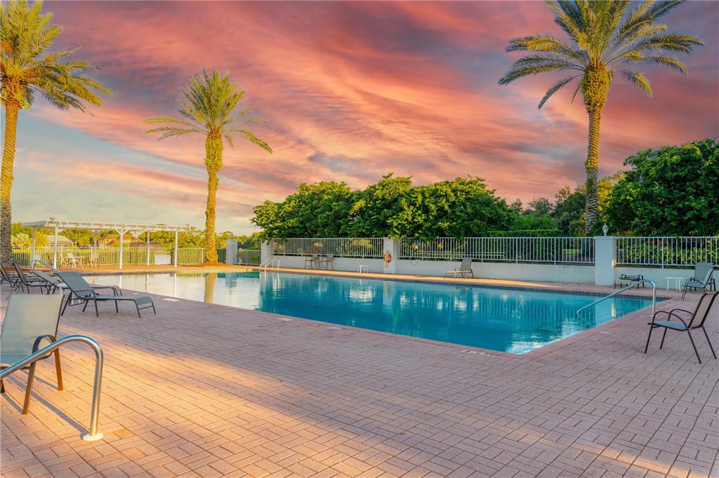 9369 Ashley Drive Weeki Wachee, FL 34613 - Photo 75 of 80 a view of swimming pool with a table and chairs