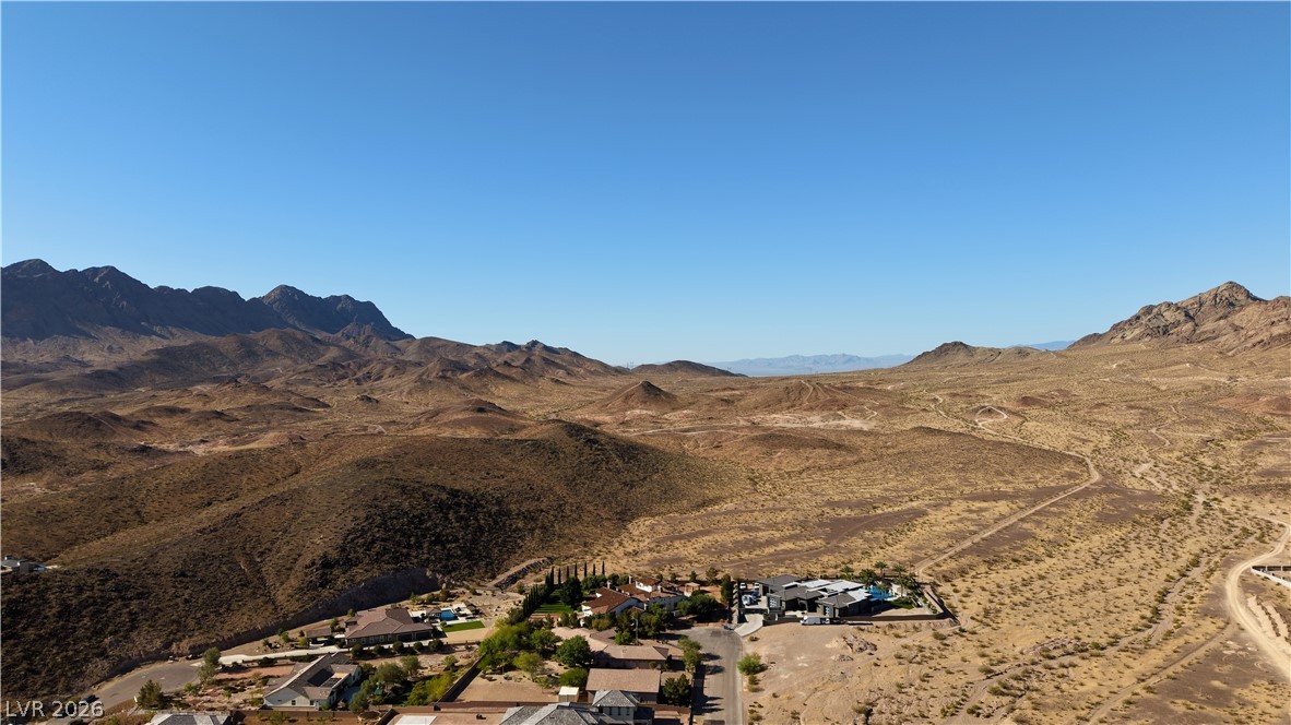 1243 Gloria Mountain Road Henderson, NV 89002 - Photo 7 of 12 Perched among arid mountains, this desert property features expansive views and a serene landscape.