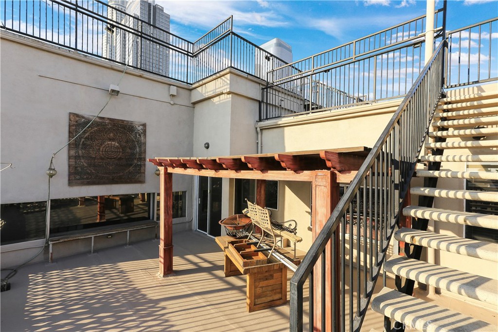 312 West 5th Street, Unit 1204 Los Angeles, CA 90013 - Photo 22 of 22 a view of a balcony with furniture