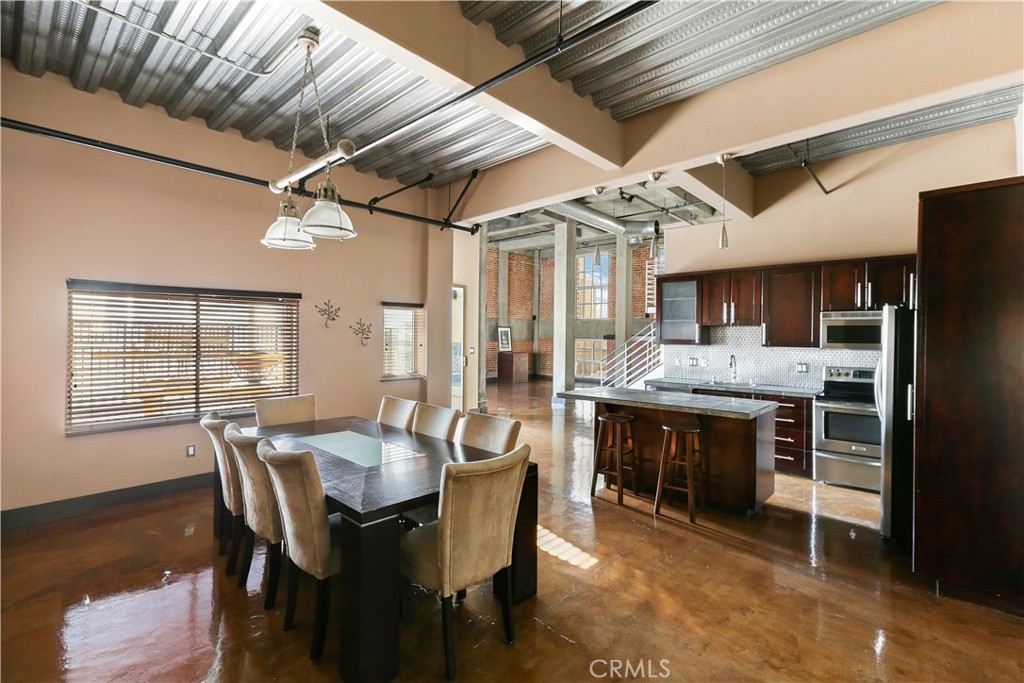 312 West 5th Street, Unit 1204 Los Angeles, CA 90013 - Photo 4 of 22 a dining room with furniture and window