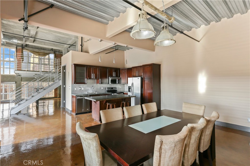 312 West 5th Street, Unit 1204 Los Angeles, CA 90013 - Photo 5 of 22 a view of a dining room with furniture and wooden floor