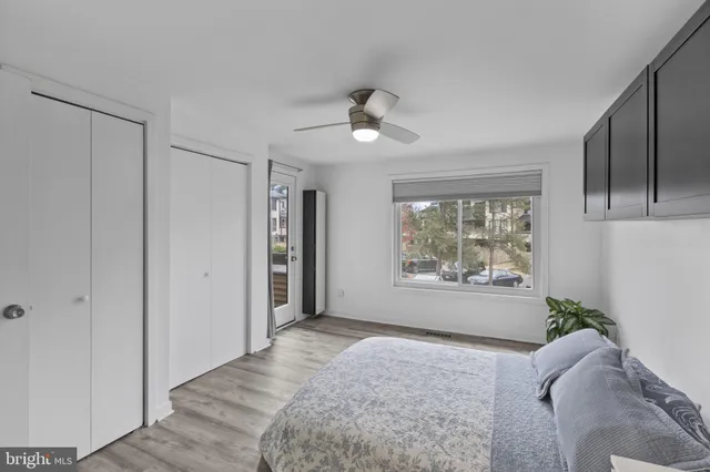 a bathroom with a sink mirror and toilet