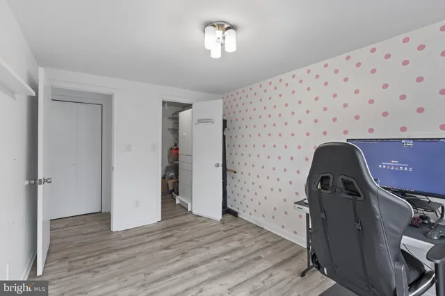 a bathroom with a shower and a sink