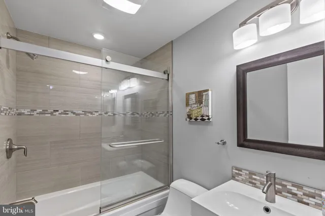 a view of storage and utility room with washer and dryer